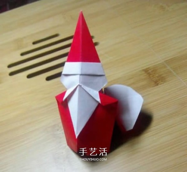 Cute Santa Claus carrying a sack and folding paper tutorial and illustration