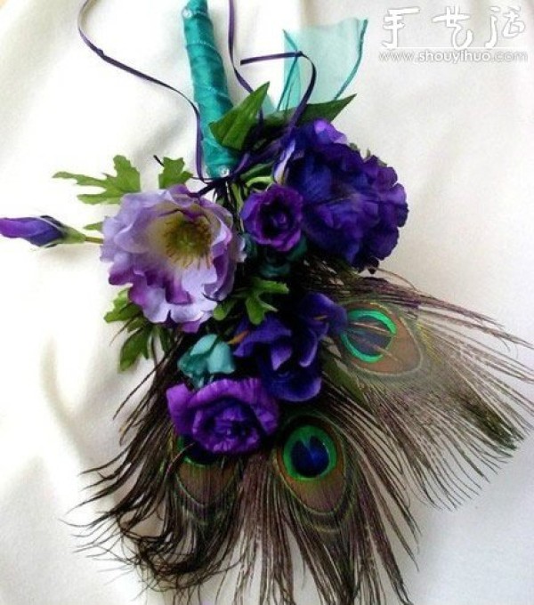 Handmade grooms corsage with peacock feathers