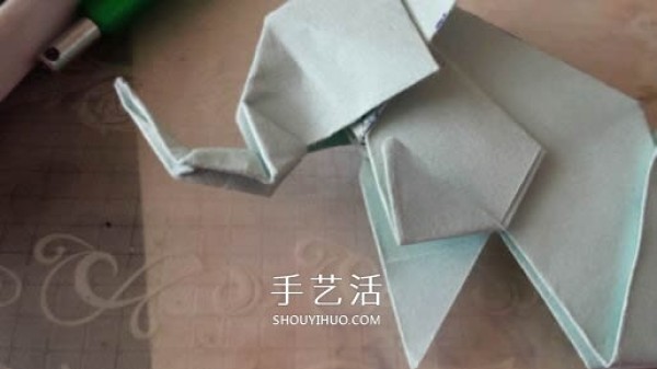 How to fold a three-dimensional elephant with diagrams and instructions for folding origami and a standing elephant