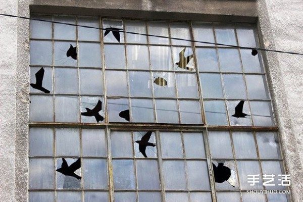 The artists humor makes the broken windows of abandoned buildings no longer scary