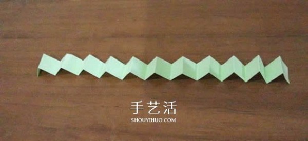 Illustration of the steps of hand-made origami Snapology ball using paper strips to make a sphere