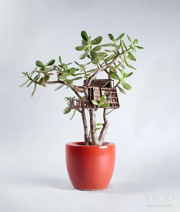 DIY exquisite treehouse model on a potted plant, a Lilliputian-like miniature building