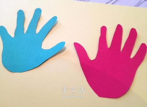 Creative childrens birthday cards are made with cardboard and two cute palms are cut