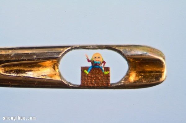 The art of ultra-micro carving in the eye of a pin