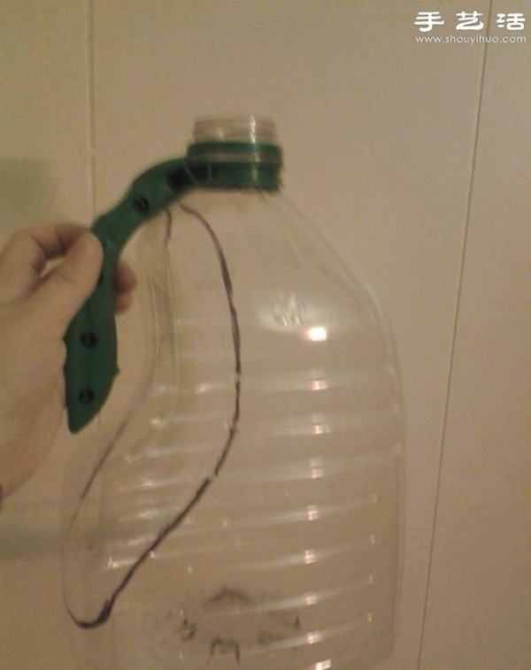 Handmade DIY bicycle handlebar windshield from plastic oil bottles