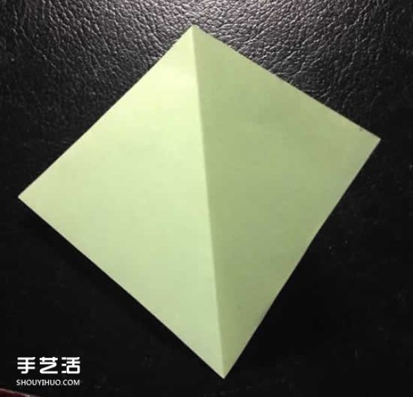 How to fold a four-petaled flower with illustrated steps. How to make an origami four-petaled flower by hand