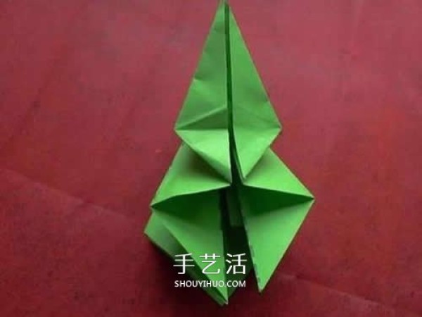 Hand-folded lilies illustrate the steps of folding a simple paper lily