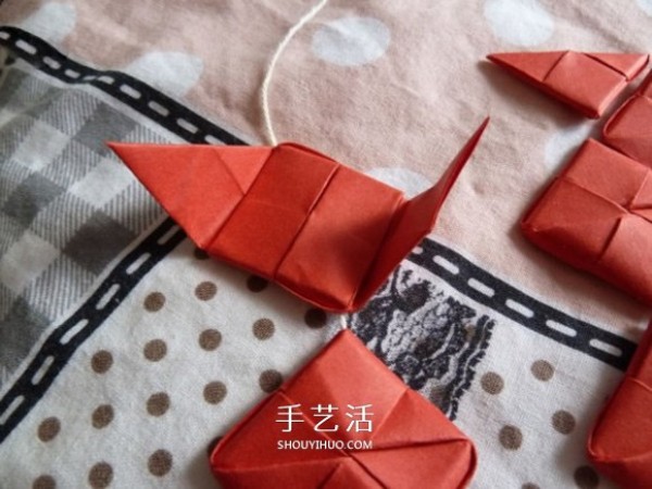 How to fold a thread through a romantic heart. Creative Valentines Day love origami illustration.