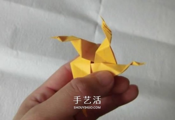 Tutorial on how to fold pearlescent conch, step-by-step diagram of origami conch