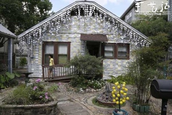 A house decorated with more than 50,000 beer bottles and cans