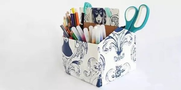 Milk cartons are made into a pen holder/storage box that can be carried