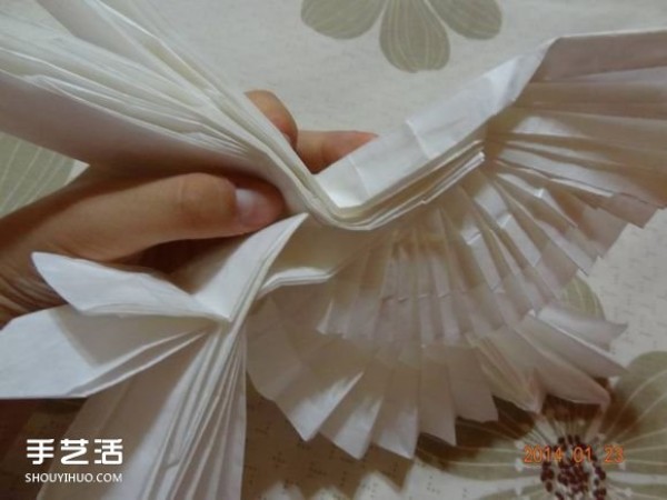 Folding of paper craneA step-by-step tutorial on how to make an origami crane by hand