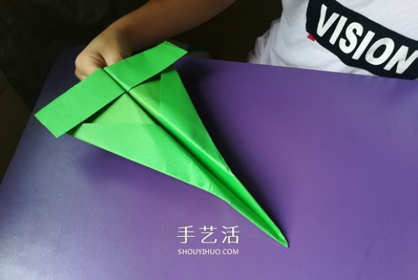 An eight-year-old boys origami sharing an illustrated tutorial on an origami fighter jet