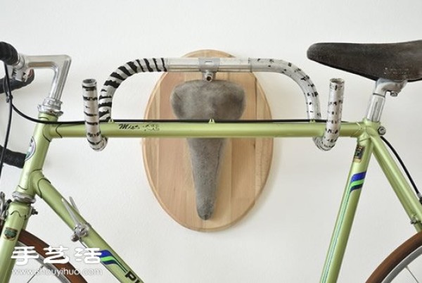 Handmade creative decorative wall hangings using discarded bicycle seats