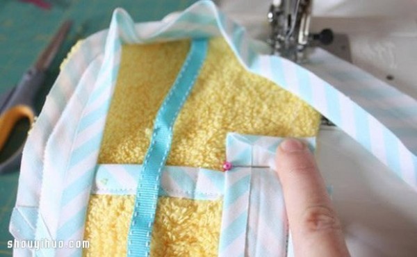 Old towels are repurposed and handmade to make toiletry storage bags