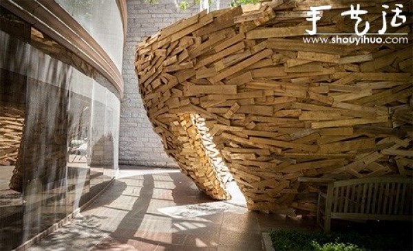 10,000 wooden planks are used to make a DIY birds nest-shaped building