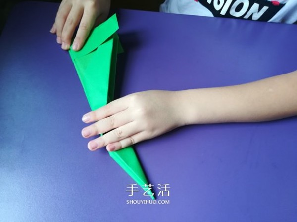 An eight-year-old boys origami sharing an illustrated tutorial on an origami fighter jet