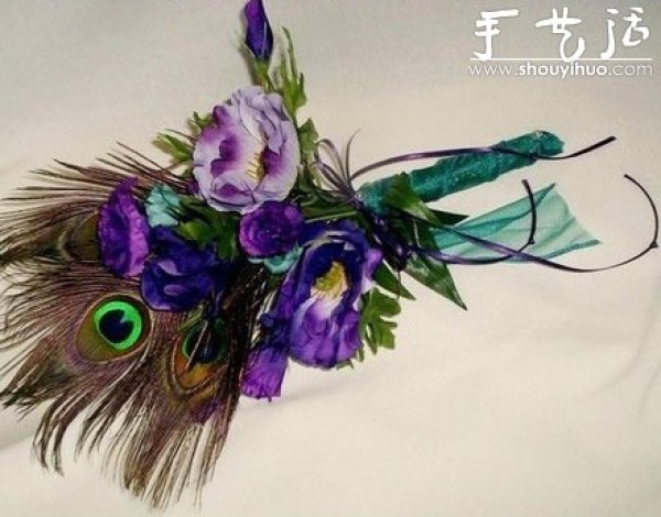 Handmade grooms corsage with peacock feathers