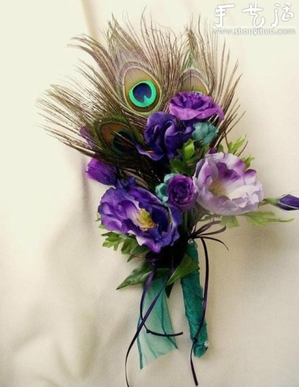 Handmade grooms corsage with peacock feathers