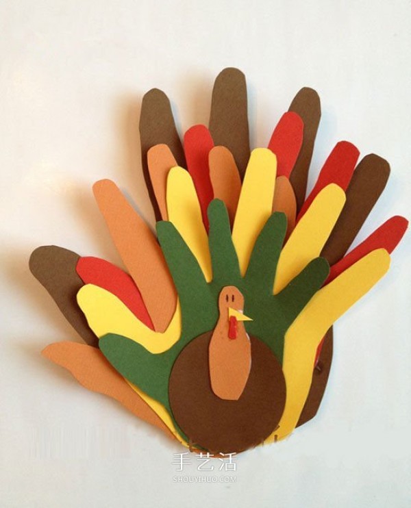 Handmade cute Thanksgiving turkey with cardboard paper-cut palm prints