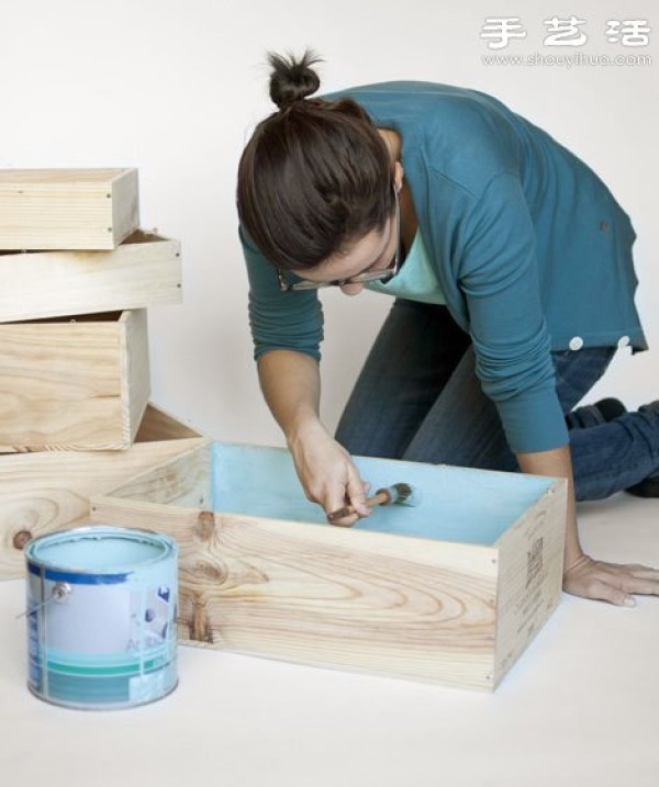 Abandoned drawers are simply transformed into handmade hanging storage cabinets