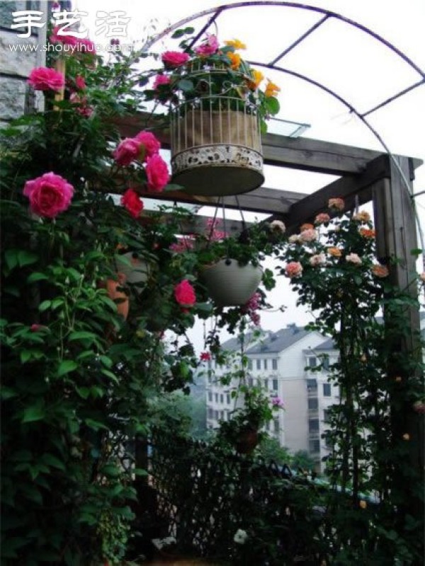 A fairy-tale balcony arrangement full of flowers and plants