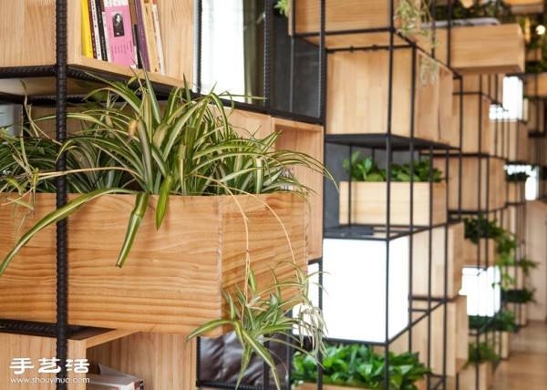 The smart design of Beijing Home Cafe with natural partitions of plants