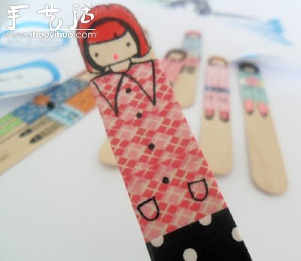 Cute little girl drawn on an ice cream stick