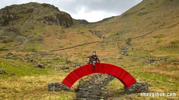 22,000 sheets of paper stacked to create a bridge that requires no glue or nails