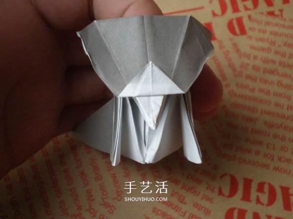 Illustrations of how to fold a cute puppy. Step-by-step pictures of origami puppies.