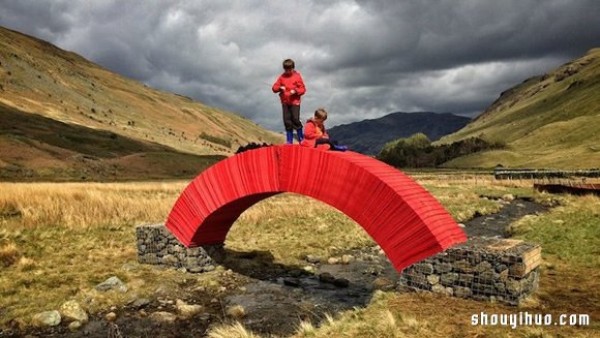 22,000 sheets of paper stacked to create a bridge that requires no glue or nails