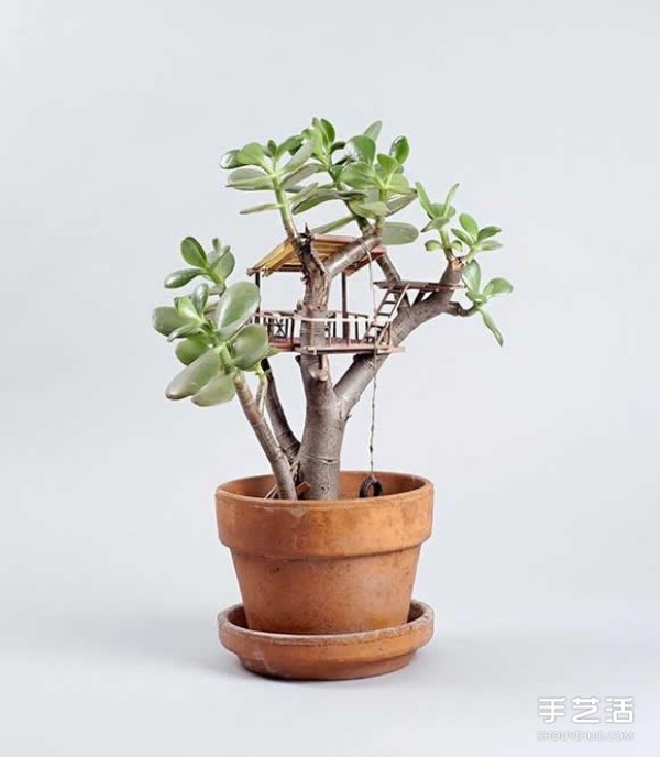 DIY exquisite treehouse model on a potted plant, a Lilliputian-like miniature building