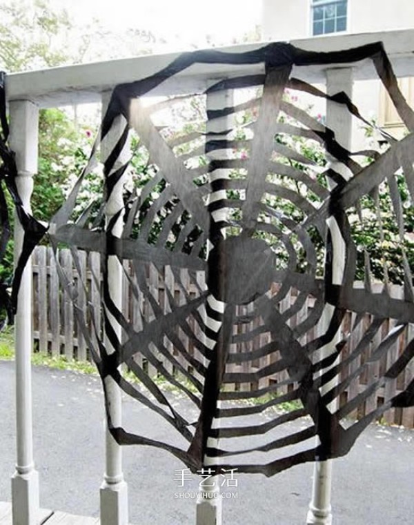 Black garbage bags are handmade to make a Halloween spider web decoration