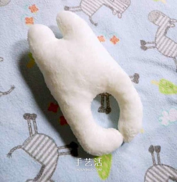 How to make a bunny hand rattle. Illustration of making a fabric cartoon hand rattle.