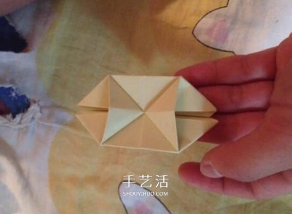 Four-petaled flower origami illustrated tutorial how to fold a four-petaled flower by hand