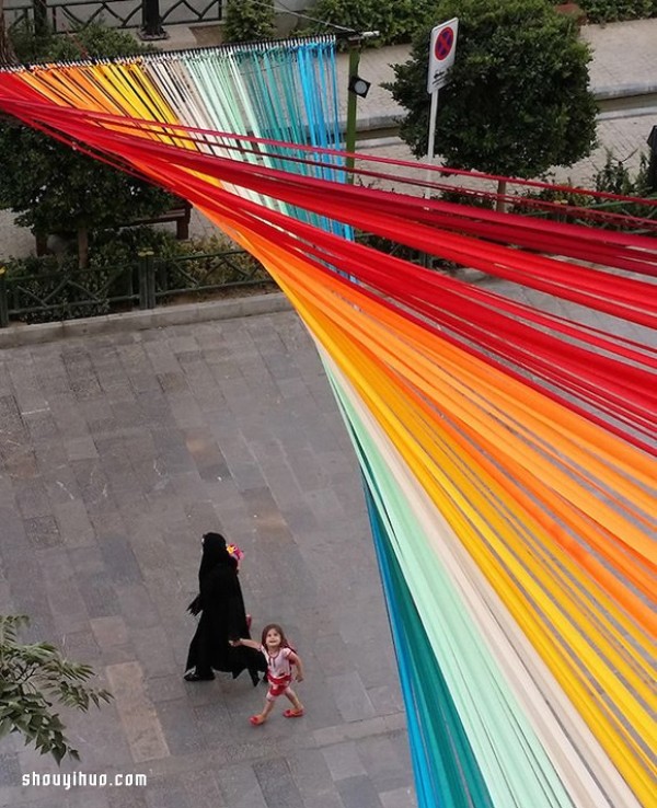 Look up and see a rainbow, a beautiful corner created by 150 colorful ribbons