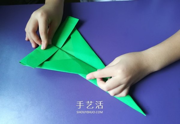 An eight-year-old boys origami sharing an illustrated tutorial on an origami fighter jet