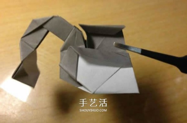 The origami method of an excavator illustrates the folding process of a manual excavator