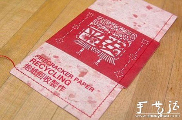 Red envelope made of firecracker debris