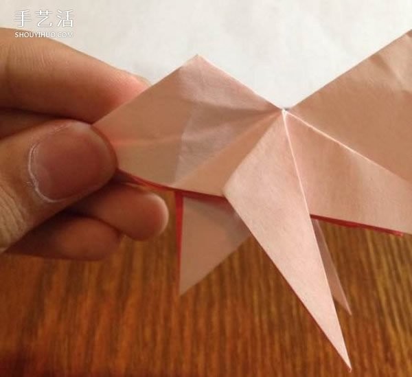 How to fold an origami poodle and illustrate the folding process of a three-dimensional poodle