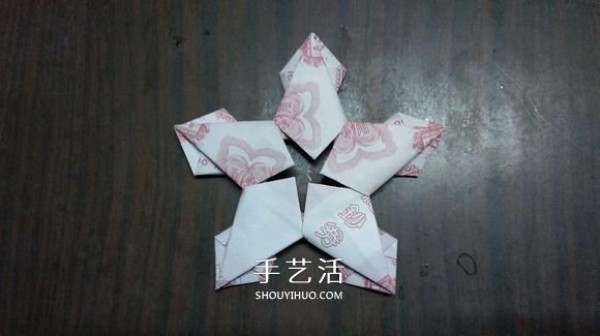 The origami method of the five-petal lotus illustrates the steps of folding the five-petal lotus with paper money