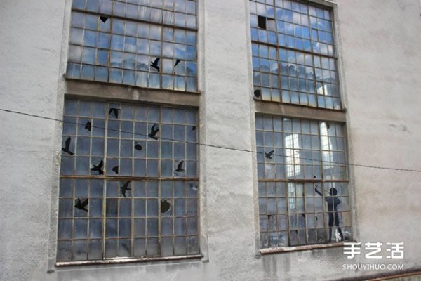 The artists humor makes the broken windows of abandoned buildings no longer scary