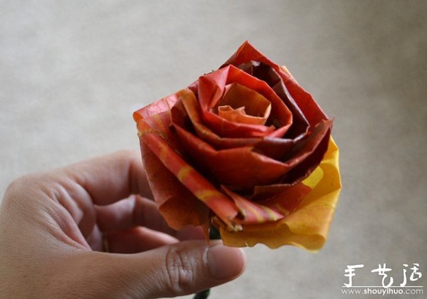 Handmade roses with fiery red maple leaves