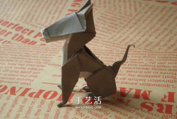 Illustrations of how to fold a cute puppy. Step-by-step pictures of origami puppies.