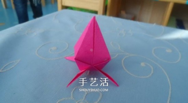 Childrens origami peach tutorial with simple instructions on how to fold a peach