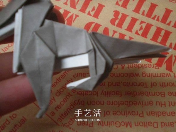 Illustrations of how to fold a cute puppy. Step-by-step pictures of origami puppies.