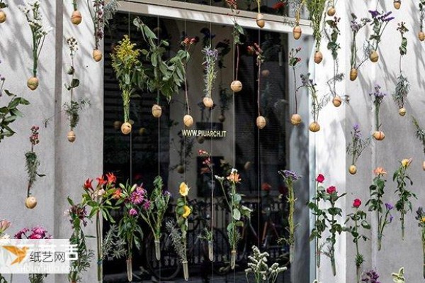 Milan designer woven 2,000 flowers into a curtain to decorate the exterior wall