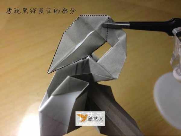 Illustration of the manual folding method of a small origami excavator