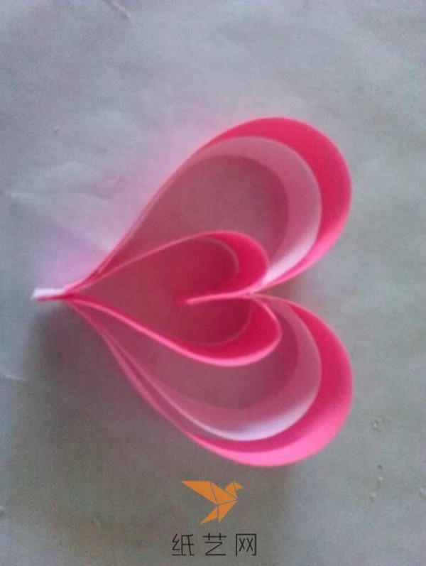 Tutorial on how to make a paper-quilled heart with wings for Valentine’s Day