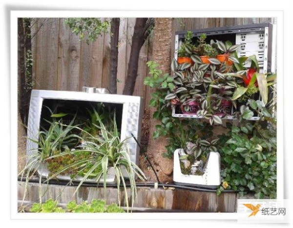 A beautiful miniature garden bonsai made from an old toaster